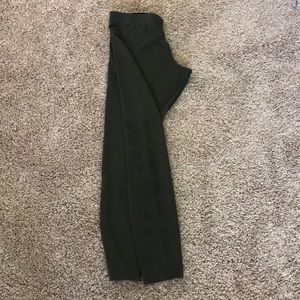 Olive green Nike leggings with “Just Do It”